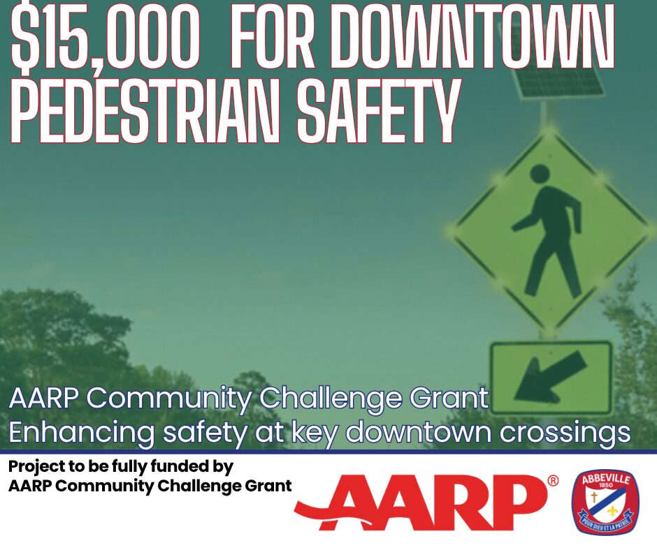 Graphic announcing that the City of Abbeville has been awarded $15,000 for downtown pedestrian safety through the AARP Community Challenge Grant. The graphic features a solar-powered pedestrian crossing beacon sign and includes the text “$15,000 for Downtown Pedestrian Safety,” “AARP Community Challenge Grant,” and “Enhancing safety at key downtown crossings.” The AARP logo and City of Abbeville seal appear at the bottom of the graphic.